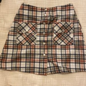 Plaid Mini Skirt. Buttons down the middle.